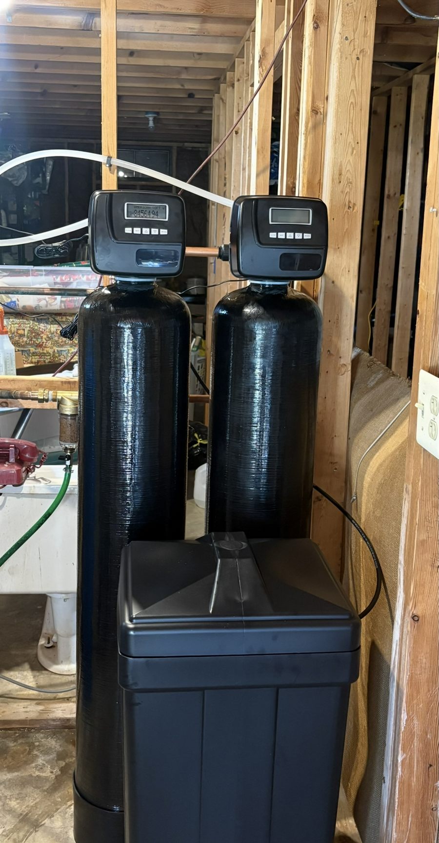 Iron filter and softener with a brine tank in an unfinished basement