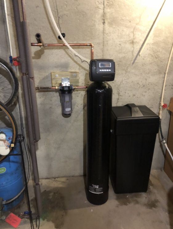 Sediment pre-filter plumbed ahead of a water softener in a basement