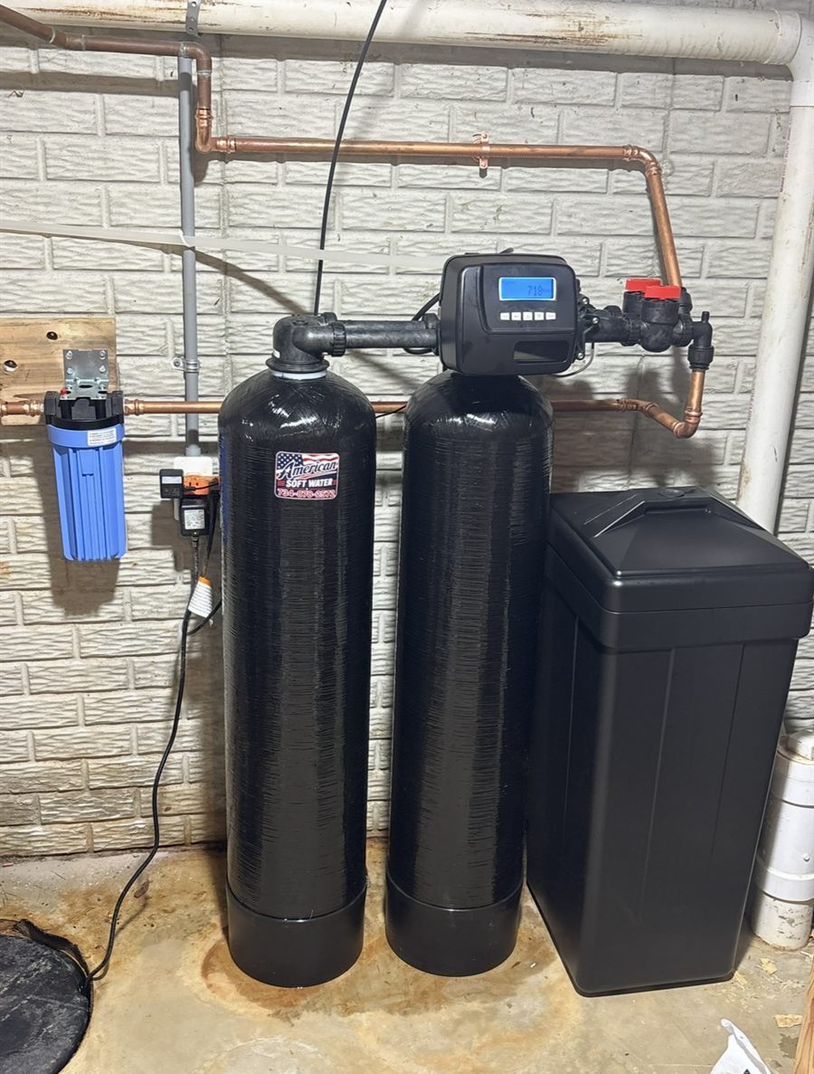 Twin-tank water softener: two black tanks sharing one digital valve, with a brine tank and sediment pre-filter